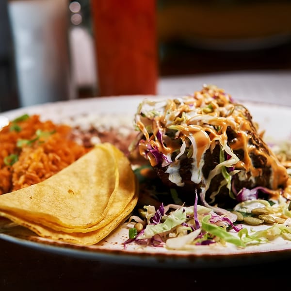 Hidalgo’s Cocina & Cócteles' Mexican dish with rice, beans, tortillas, and a large taco.